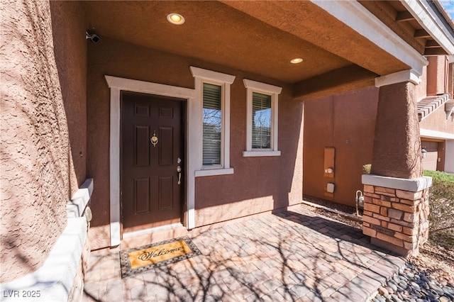 doorway to property with stucco siding