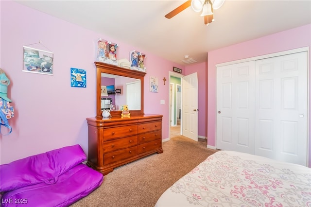 carpeted bedroom featuring baseboards, a ceiling fan, and a closet