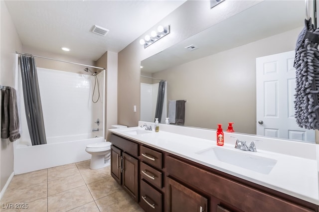 full bath featuring toilet, tile patterned flooring, a sink, and visible vents