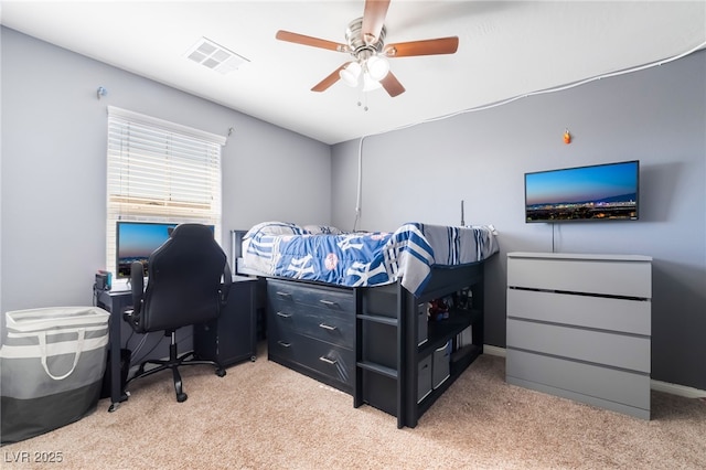 bedroom with light carpet, baseboards, visible vents, and a ceiling fan