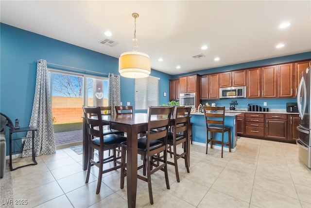 dining room featuring light tile patterned floors, visible vents, and recessed lighting