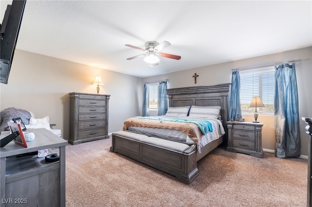 bedroom featuring a ceiling fan and light colored carpet