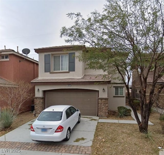 traditional home featuring a garage, stone siding, decorative driveway, and stucco siding