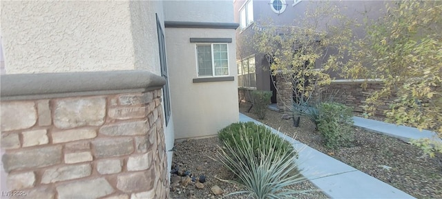 view of side of home featuring stucco siding