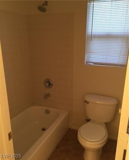 full bath featuring baseboards, tub / shower combination, toilet, and tile patterned floors