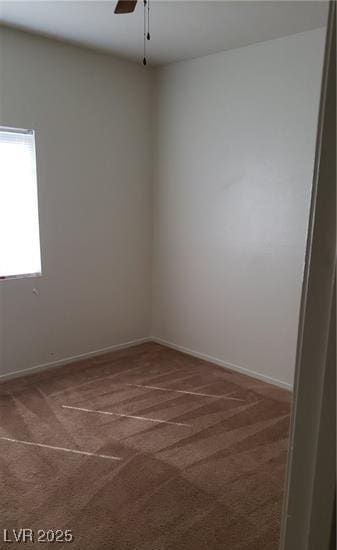 unfurnished room with carpet flooring, ceiling fan, and baseboards