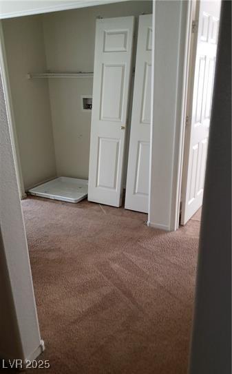 unfurnished bedroom featuring a closet and carpet flooring