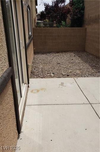 view of yard featuring a patio area and fence