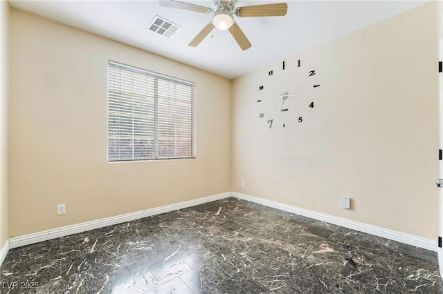 empty room featuring marble finish floor, a ceiling fan, visible vents, and baseboards