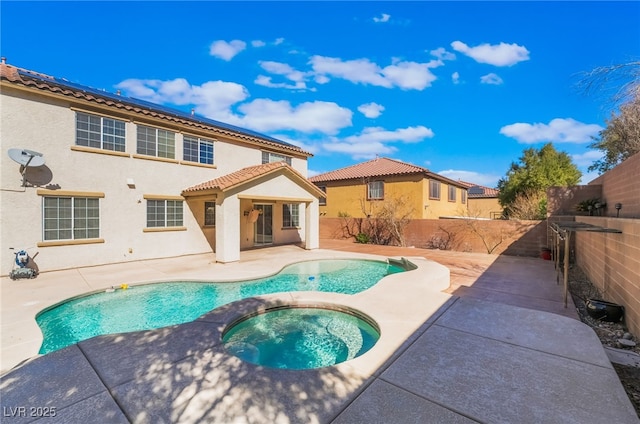 view of pool with a patio area, a fenced backyard, a fenced in pool, and an in ground hot tub