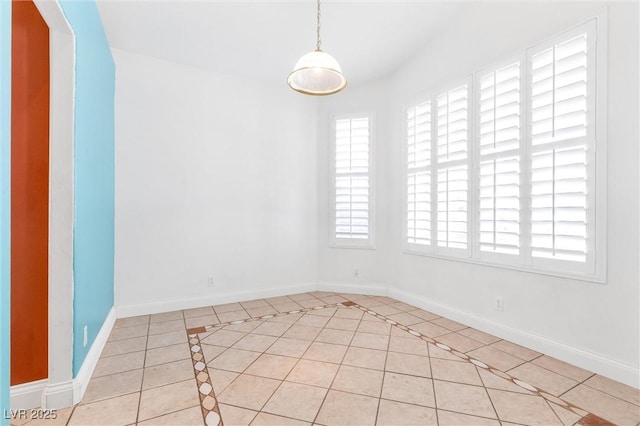 tiled empty room with baseboards