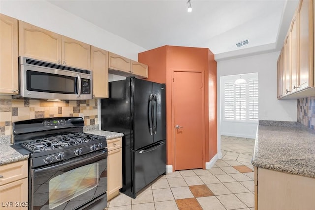 kitchen with black appliances, tasteful backsplash, light tile patterned flooring, and visible vents