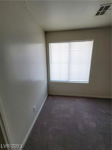 empty room with visible vents and baseboards