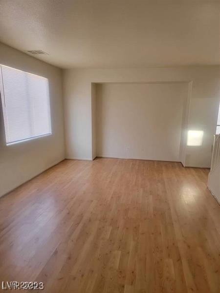 spare room featuring visible vents and light wood-style flooring