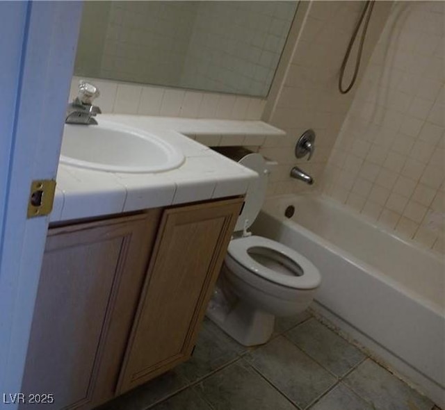 bathroom featuring shower / bathing tub combination, tile patterned flooring, vanity, and toilet