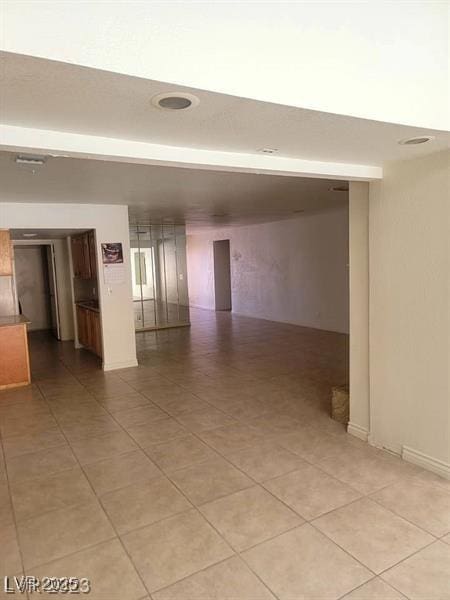 spare room with light tile patterned floors