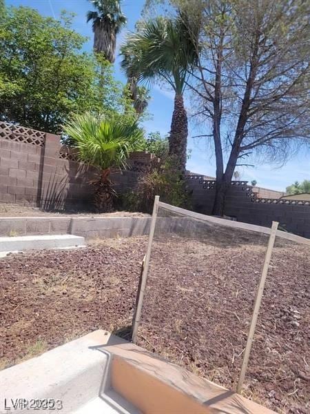 view of yard with a fenced backyard