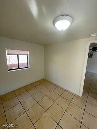 empty room with light tile patterned flooring