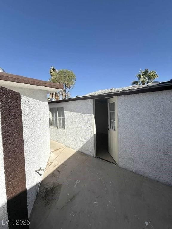 view of property exterior with a patio area and stucco siding