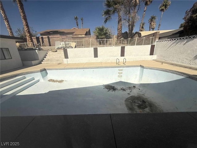 view of swimming pool featuring a patio, a fenced backyard, and a fenced in pool