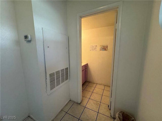 hallway featuring light tile patterned floors