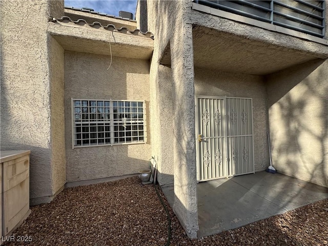 view of property exterior with stucco siding