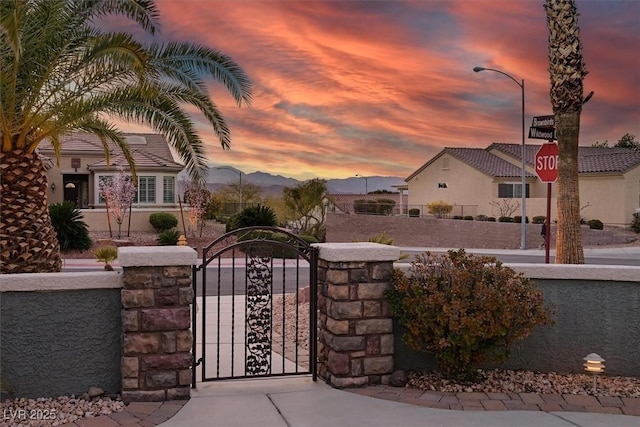 view of gate with fence