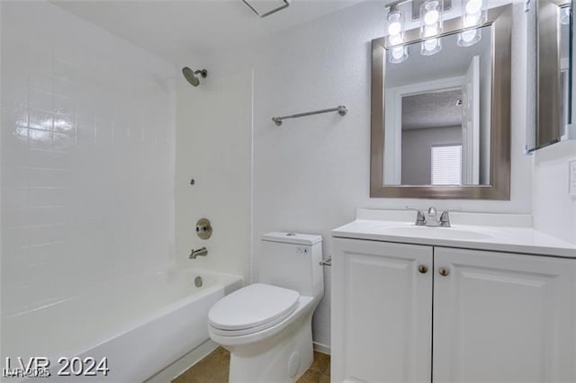 full bathroom featuring washtub / shower combination, vanity, and toilet