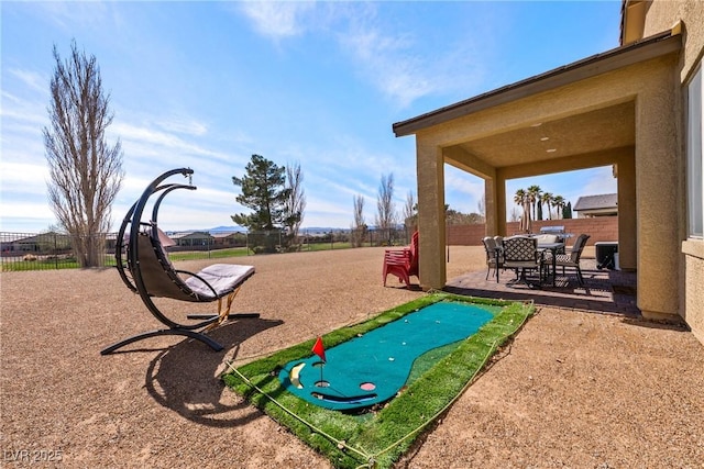 surrounding community featuring a patio area and fence