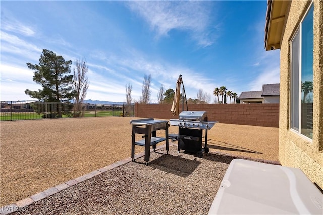 exterior space featuring a patio area and a fenced backyard