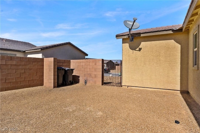 view of yard with a gate and fence