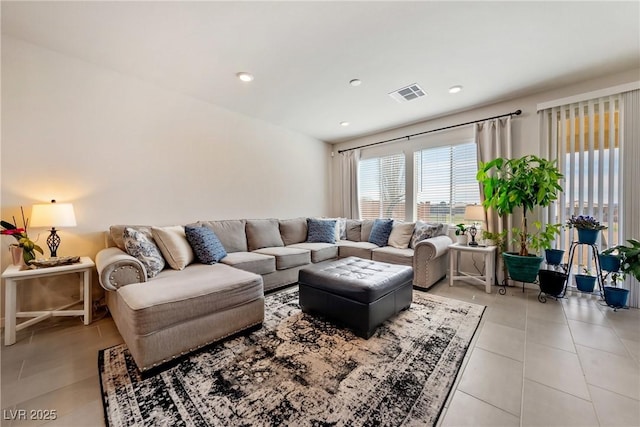 living room featuring light tile patterned floors, visible vents, and recessed lighting