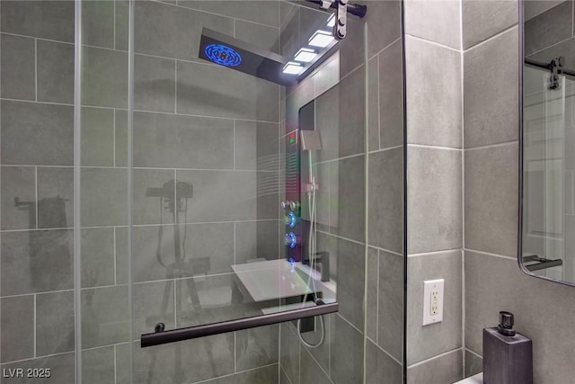 bathroom with tiled shower