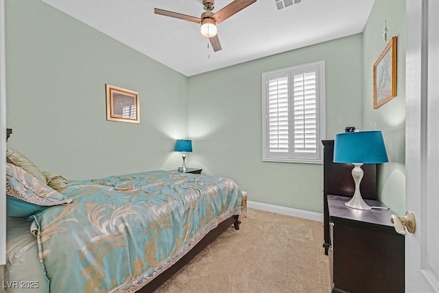 bedroom with carpet, baseboards, and ceiling fan