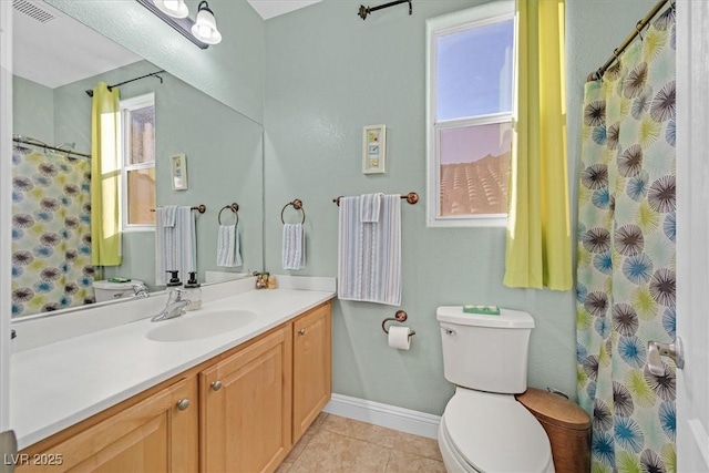 bathroom featuring baseboards, visible vents, toilet, tile patterned floors, and vanity