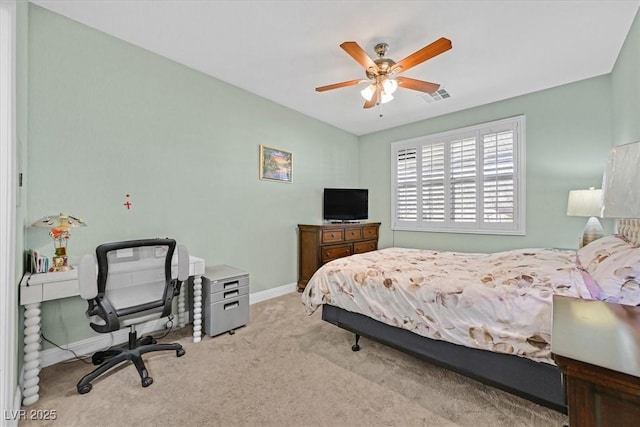 bedroom featuring carpet floors, baseboards, visible vents, and a ceiling fan