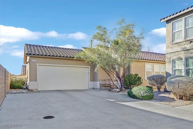 mediterranean / spanish-style home with a tile roof and stucco siding