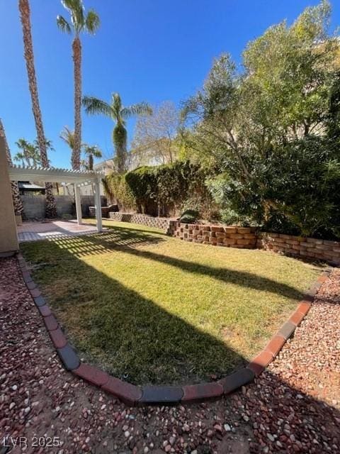 view of yard with a patio area and a pergola