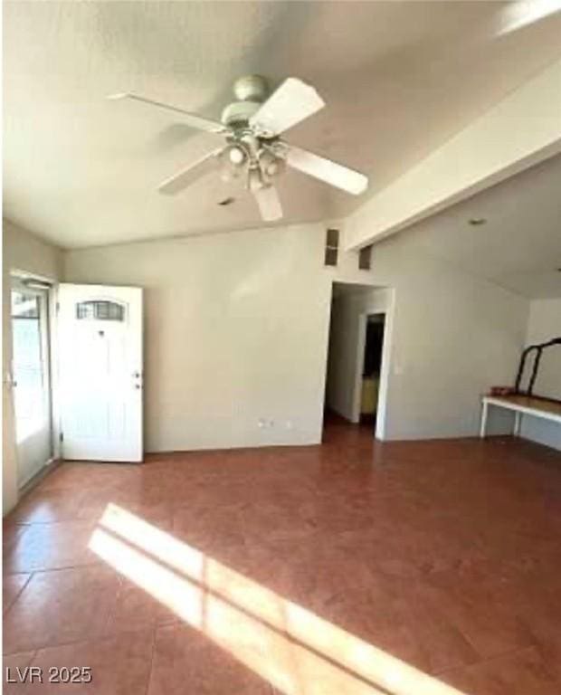 empty room with vaulted ceiling with beams and ceiling fan