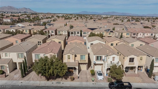 drone / aerial view featuring a residential view and a mountain view