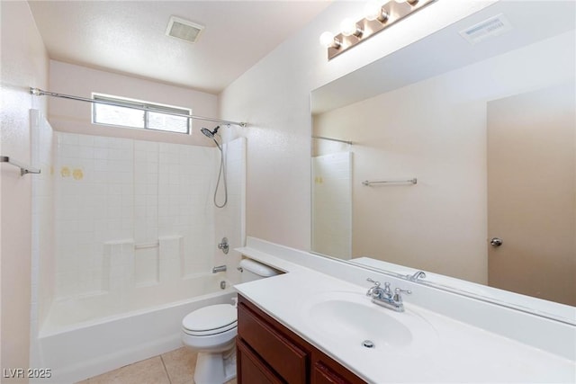 bathroom with visible vents, vanity, toilet, and tile patterned floors