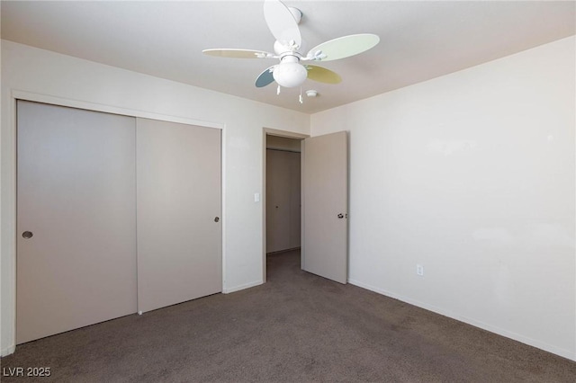 unfurnished bedroom with carpet, baseboards, ceiling fan, and a closet