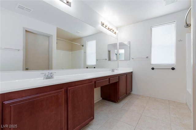 full bathroom with double vanity, tile patterned flooring, a sink, and visible vents