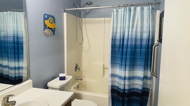 bathroom with toilet, shower / bath combination with curtain, and vanity