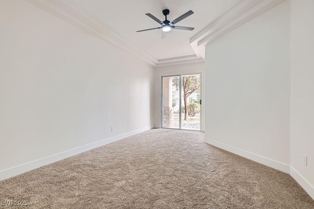 spare room featuring baseboards, carpet, and a ceiling fan