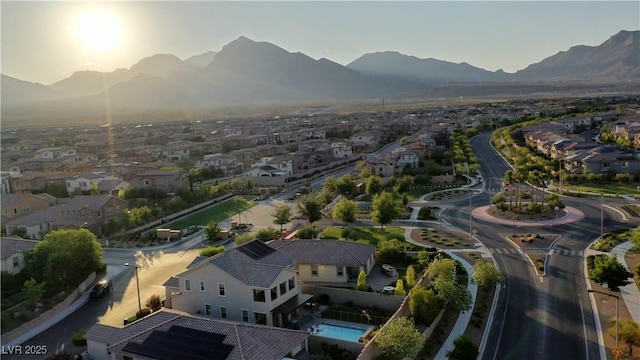 drone / aerial view with a residential view and a mountain view