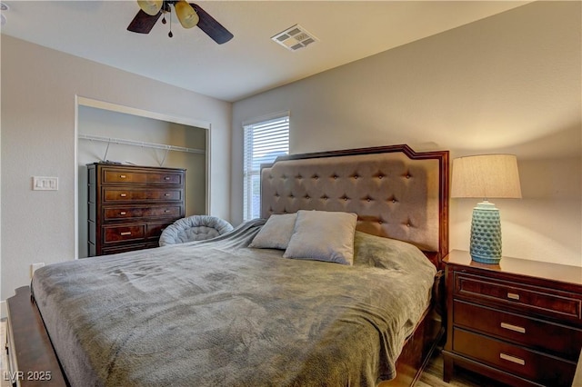 bedroom featuring a ceiling fan, a closet, and visible vents