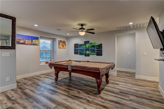 rec room with baseboards, visible vents, and wood finished floors