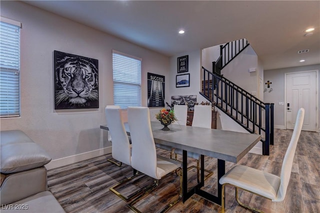 dining space featuring stairs, recessed lighting, baseboards, and wood finished floors