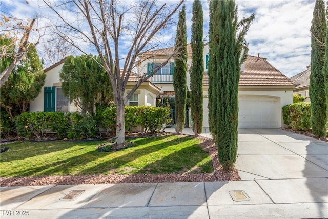 obstructed view of property with a garage, a front yard, concrete driveway, and stucco siding